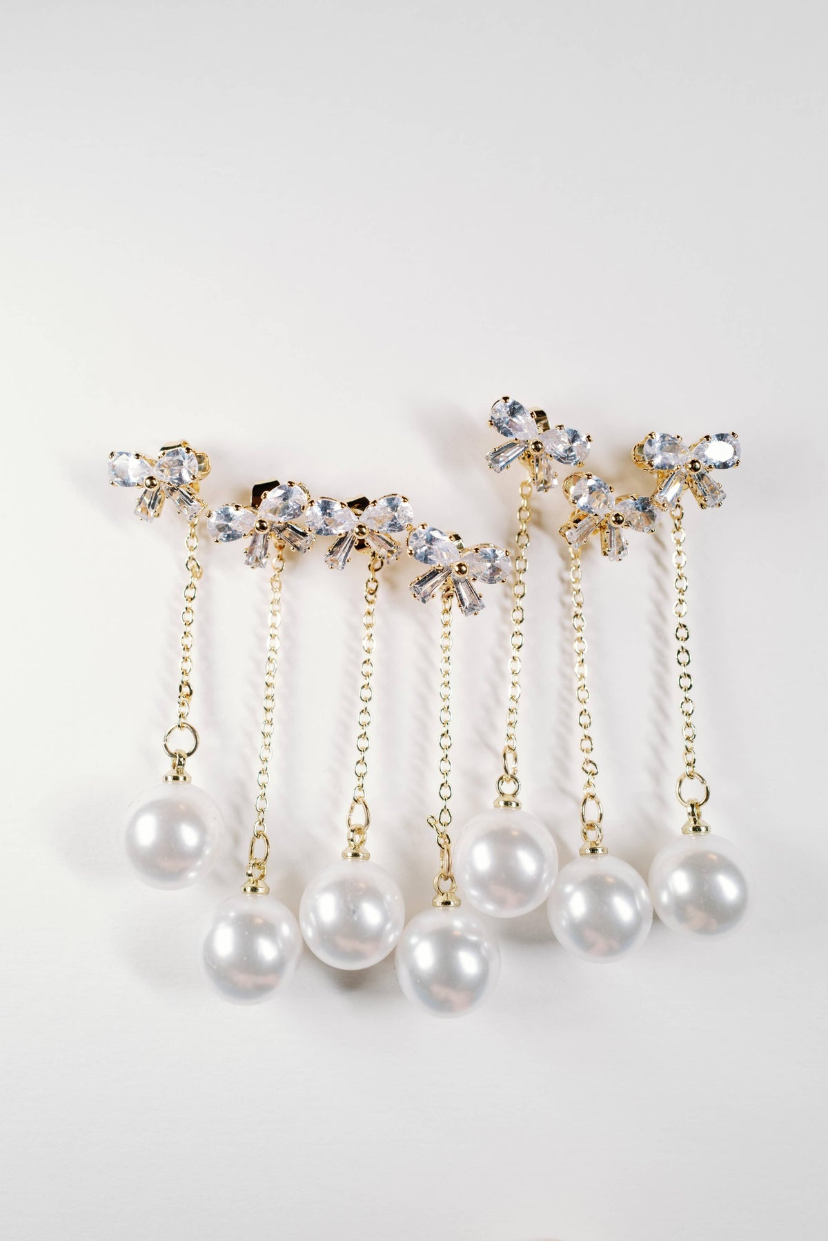 Crystal Bow and Pearl Drop Swingy Statement Earrings